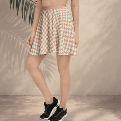 Person wearing a checkered skirt with a neutral background