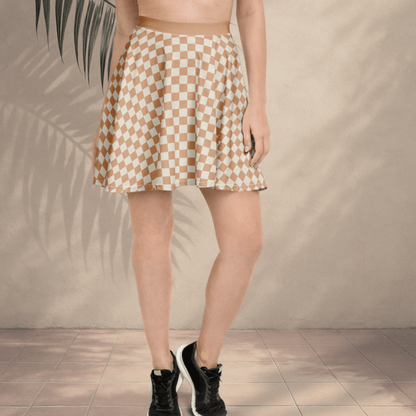 Person wearing a checkered skirt with a neutral background