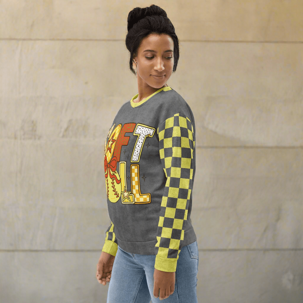 Woman wearing a gray sweatshirt with 'SOFTBALL' design on a neutral background