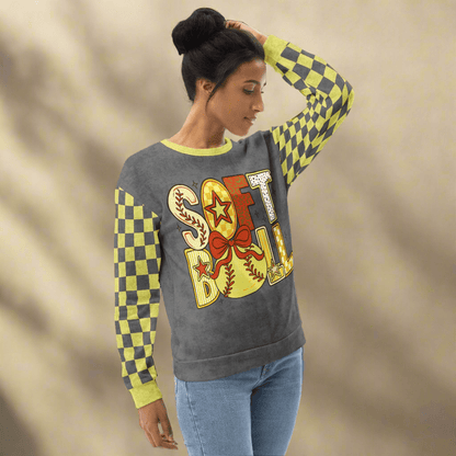 Woman wearing a colorful checkered sleeve sweatshirt with 'SOFTBALL' design on a beige background