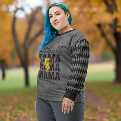 Woman wearing a gray sweatshirt with 'Softball Mama' text and lightning bolt graphic in an outdoor setting.