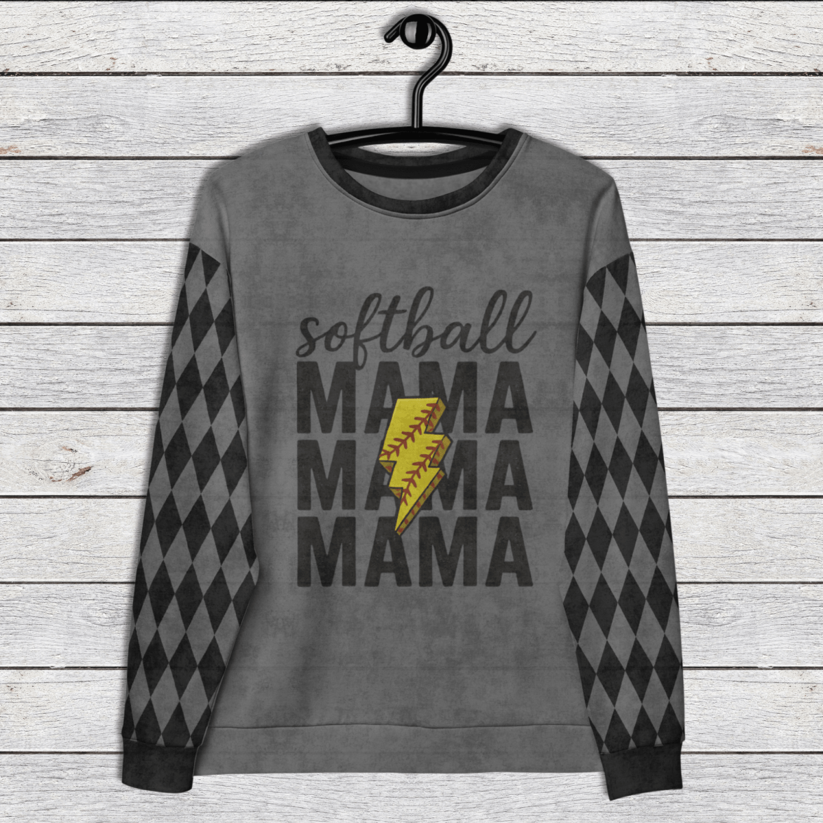 Gray sweatshirt with 'softball MAMA MAMA MAMA' text and yellow softball graphic on a wooden background
