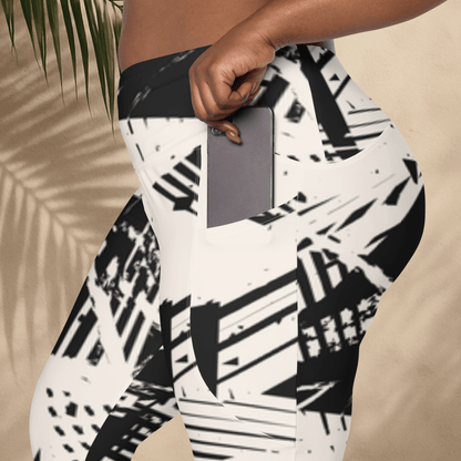 Person wearing a black and white patterned leggings with a neutral background