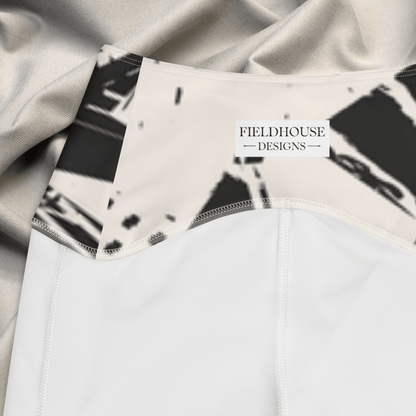 Close-up of a waistband with 'Fieldhouse Designs' label, featuring abstract black and white pattern.