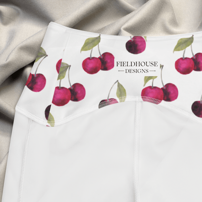 White waistband with cherry pattern and 'Fieldhouse Designs' branding on a gray fabric background