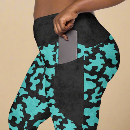 Turquoise and black camouflage leggings with a pocket.