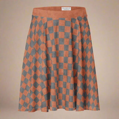 Checkered skirt with orange and gray pattern on a beige background