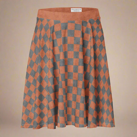 Checkered skirt with orange and gray pattern on a beige background