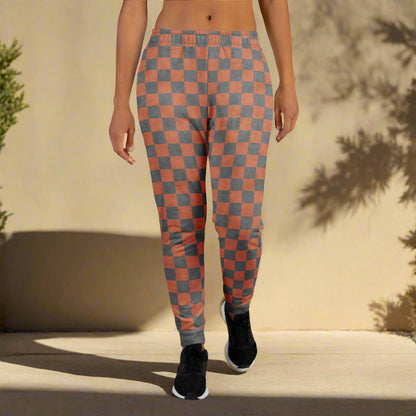 Checkered pants worn by a person on a beige background