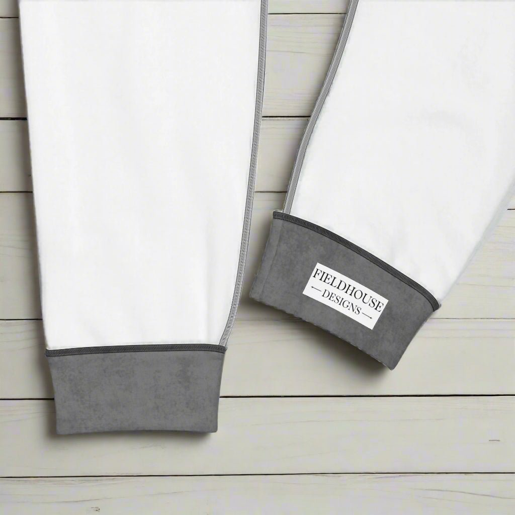 Jogger cuffs with Fieldhouse Designs logo on a wood background