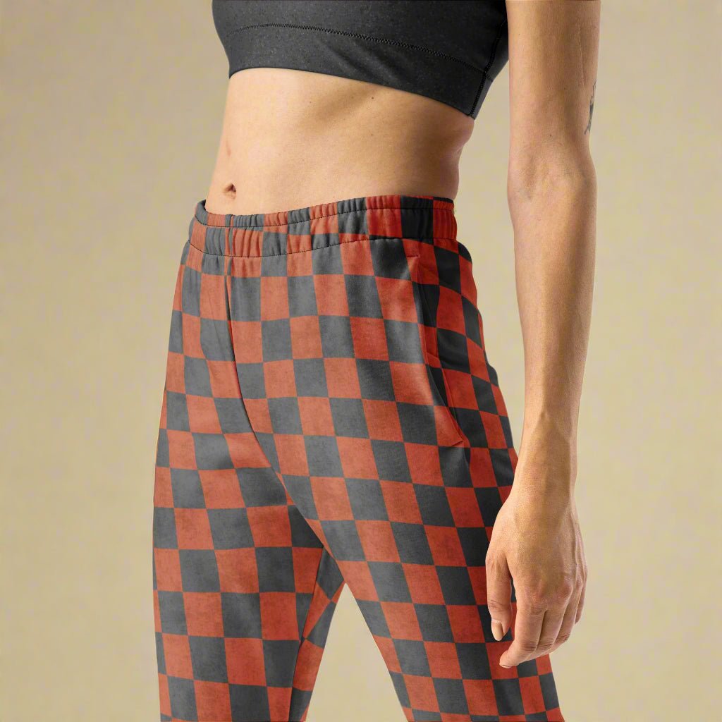 Terracotta checkered pants worn by a person on a beige background
