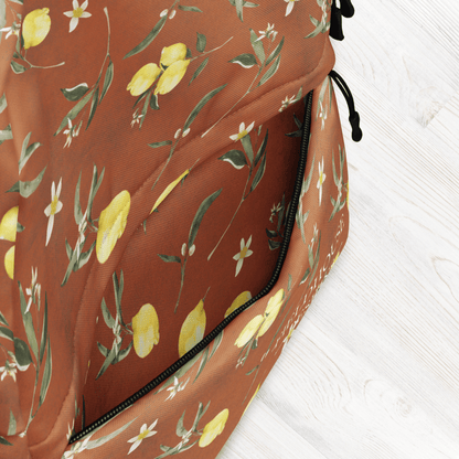 Backpack with lemon and leaf pattern on a white background