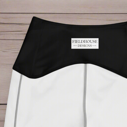 Black waistband with 'Fieldhouse Designs' label on a textured fabric background