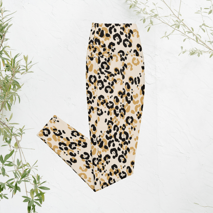 Leopard print leggings on a white background with green leaves.