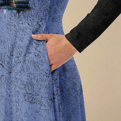 Close-up of a textured blue dress with a hand in the pocket on a beige background